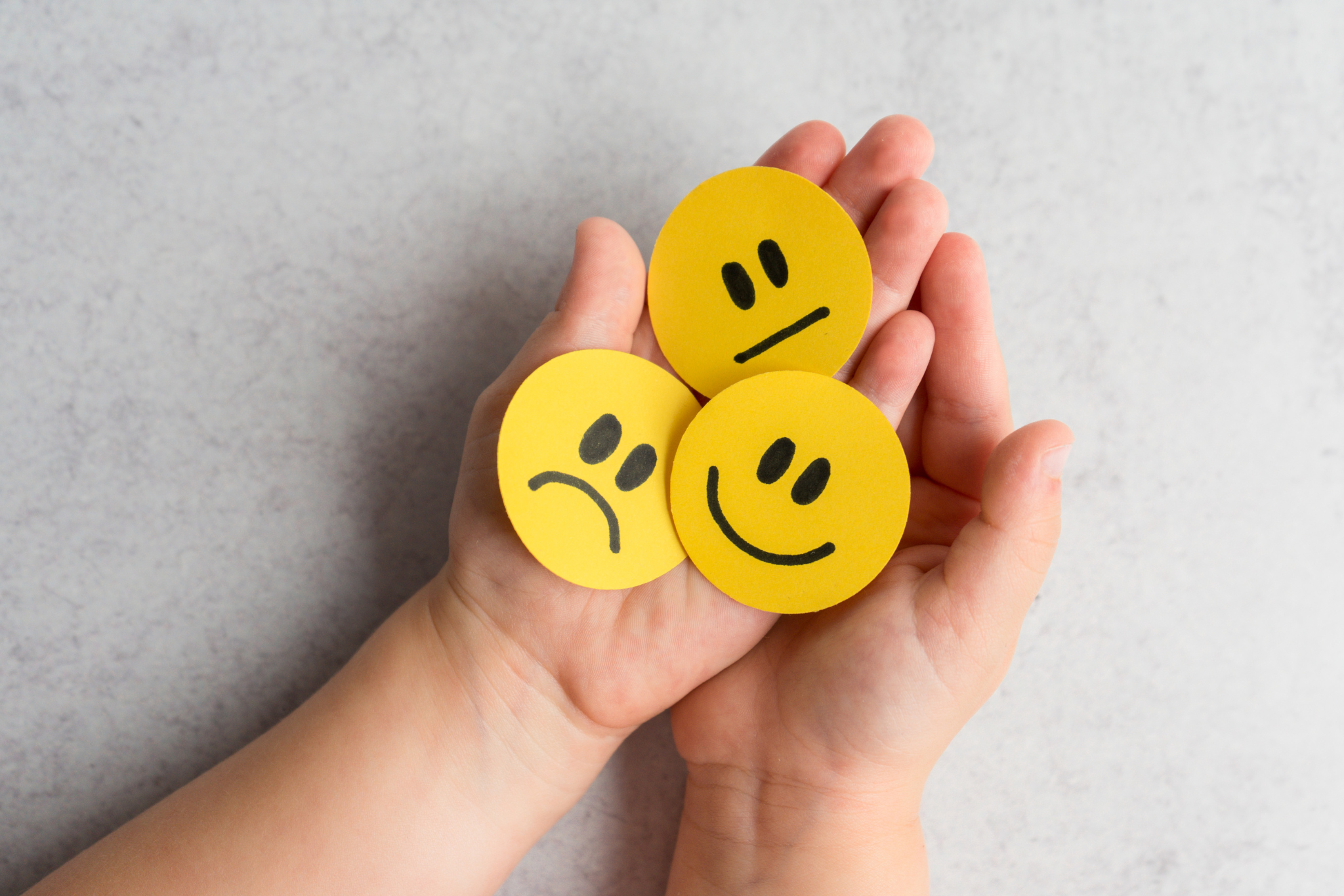 Emotional Inteligence Emojis in Hands