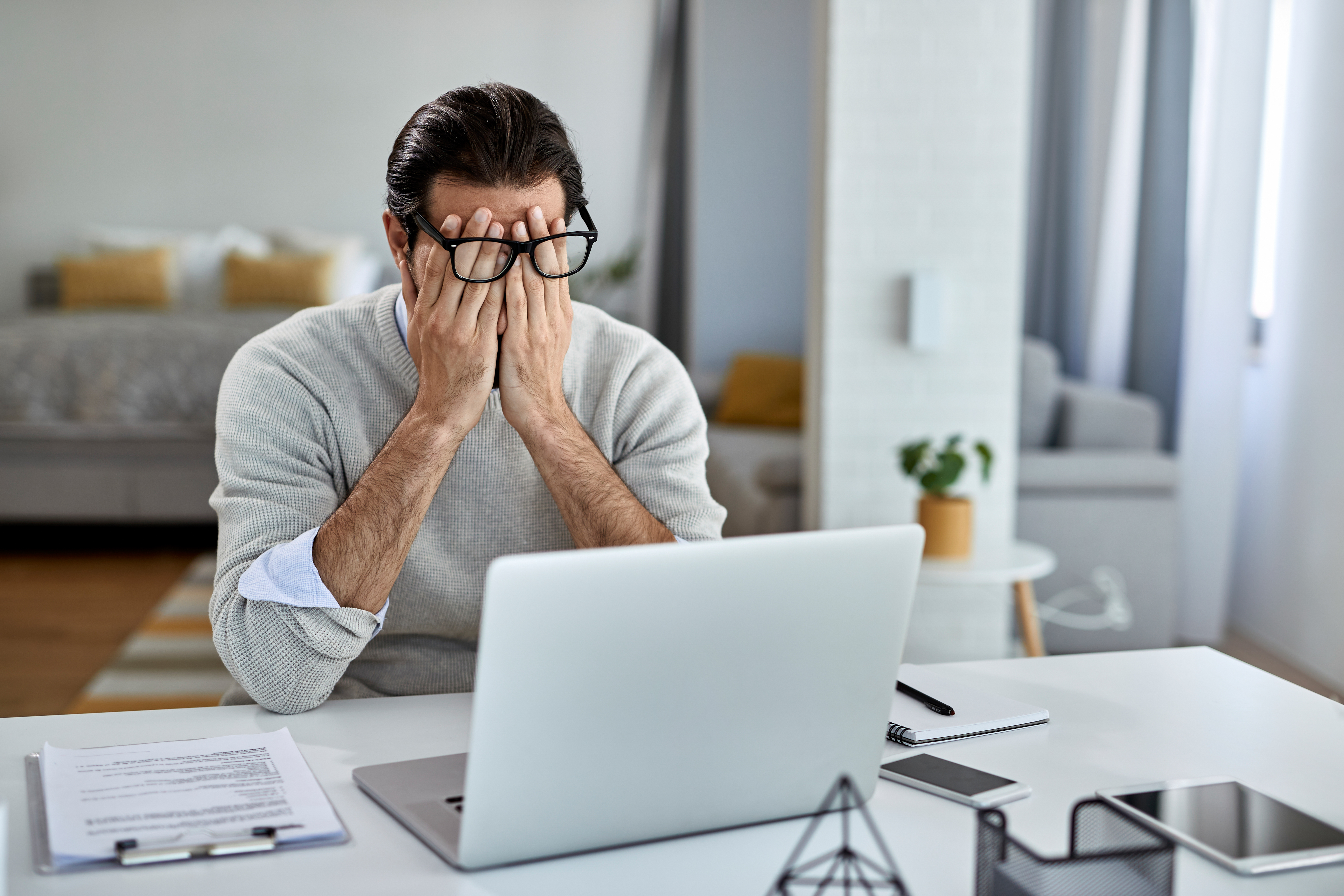 Businessman Feeling Exhausted After Working Laptop Home